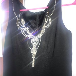 Mid length black dress.